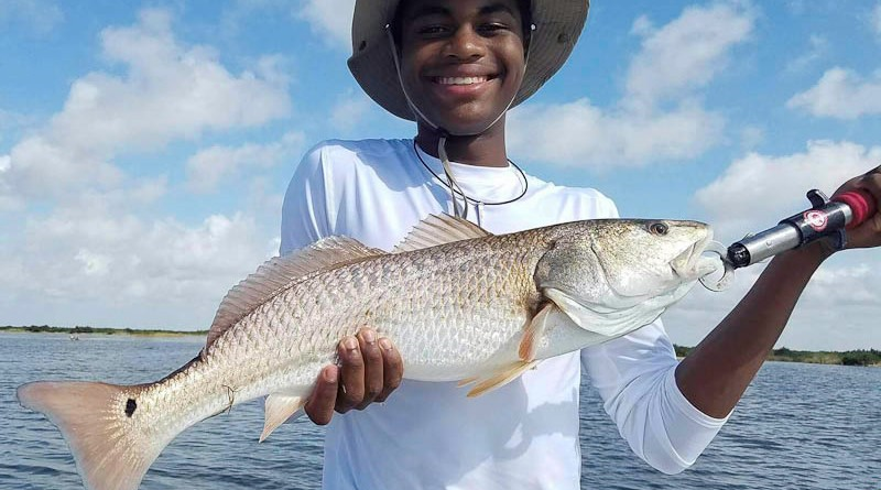 Big 27" Redfish for Christian P. fishing with his dad Adam.